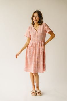 Introducing the Boice Button Front Dress! In peach with a playful textured finish, this dress is perfect for any occasion. With its one-of-a-kind design, it will surely make a statement and turn heads. Get ready to stand out and have some fun in the Boice Button Front Dress! Details self/lining: 70% polyester + 25% rayon + 5% spandex Fabric Care Guide Here Sizing & Fit Measurements are approximate and taken while laying flat across the front. Not doubled. small: bust = 18"; waist = 17"; length = Mom Bod, Maxi Dress Pattern, Contrast Blouse, Floral Denim, Button Front Dress, Denim Romper, Tiered Midi Dress, Floral Jumpsuit, Knit Tees