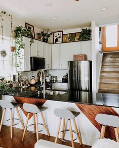 the kitchen is clean and ready for us to use it's counter tops are black