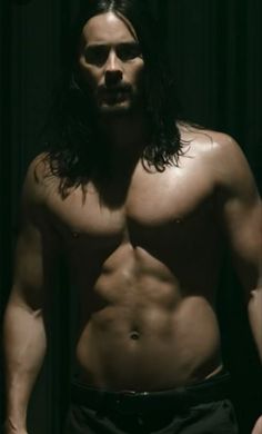 a shirtless man with long hair and no shirt