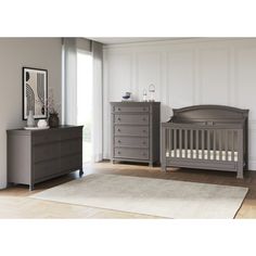 a baby crib and dresser in a room