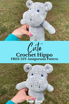 the crochet hippo is being held up by someone's hand in front of