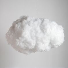 a white cloud hanging from a string in the air