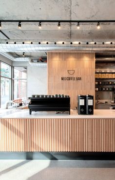 the interior of a modern coffee shop