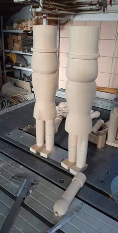 two large wooden legs on top of a machine