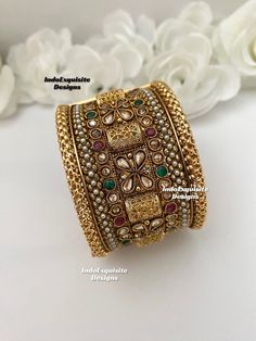 Extra wide very elegant Handcrafted Gold Plated Openable Screw Kada ( Single Pc) /High Quality Openable Kada/Gold Plated Polki bangles /South Indian Openable bangles/Classic Bangles/ designer Bangles  width approx 4.5cm  All items are shipped from Brampton, Ontario, Canada. If you need your item by a certain day, please reach out to us for express delivery option before placing the order so that we can update the shipping for you. Standard shipping/delivery timeline Below are the delivery timeline estimates. We dispatch all orders by the next business day. ---> USA delivery timeline * 2-6 business days to major urban centers in USA. It may take 1-2 days extra to remote locations ---> Canada delivery timeline  * 2-3 business days - GTA  & Montreal  * 2-4  business days - Rest of Ontario/Que Elegant Tilla Cuff Bracelet For Festive Occasions, Elegant Multicolor Cuff Bracelet For Festive Occasions, Elegant Festive Tilla Cuff Bracelet, Heavy Fusion Bangle For Ceremonial Occasions, Elegant Multicolor Openable Bangle, Multicolor Openable Bracelets For Wedding, Fusion Style Openable Bangle For Wedding, Elegant Tilla Cuff Bracelet For Wedding, Elegant Cuff Bracelet For Wedding And Festive Occasions