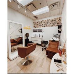 a salon with chairs and mirrors in it