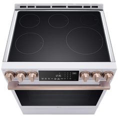 an electric stove with four burners on the front and two ovens on the back