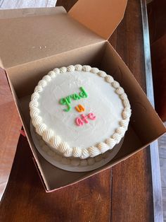 a birthday cake in a box on a table