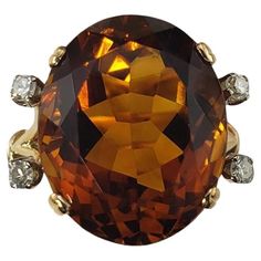 18K Yellow Gold Citrine and Diamond Ring Size 5.25 JAGi Certified- This stunning ring features one oval citrine quartz stone (16 mm x 13.5 mm) and four round single cut diamonds set in 18K yellow gold. Shank: 2 mm. Citrine weight: 11.82 ct. Total diamond weight: .13 ct. Diamond color: H-I Diamond clarity: SI1-SI2 Ring Size: 5.25 Stamped: 18K Weight: 4.0 dwt./ 6.3 gr. JAGi Certificate included. Very good condition, professionally polished. Will come packaged in a gift box or pouch (when possible) and will be shipped U.S. Priority Mail Insured. DV04082417KCS Quartz Stone, Jewelry Rings Engagement, Diamond Clarity, Citrine, Colored Diamonds, Ring Verlobung, Diamond Ring, Diamond Cuts, Ring Size