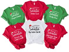 six christmas shirts with santa written on them