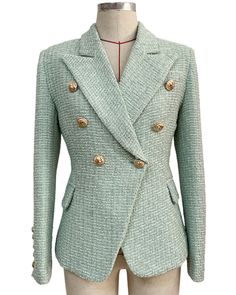 Taylor Light Green Tweed Double Breasted Blazer with Gold Buttons - SLIM FITFeatures: - Slim Fit Design - Single Gold Button Closure - Gold Button Cuffs - Peak Lapels - Two Faux Side Pockets - Shoulder Padding The Taylor Light Green Tweed Double Breasted Blazer is a chic and unique light green tweed blazer with gold buttons, designed to make a statement and add a touch of personality to your wardrobe. This blazer is a true standout piece, crafted with high-quality materials and impeccable attention to detailThe light green tweed fabric is sophisticated and stylish, giving the blazer a refined and timeless appeal. The gold buttons add a touch of luxury, complementing the tweed fabric perfectly and creating a look that is both elegant and eye-catching. This blazer is a versatile piece that c Mint Green Office, Long Tweed Coat, Office Suit, Green Office, Green Tweed, Blazer Women, Service Women, Tweed Coat, Tweed Blazer