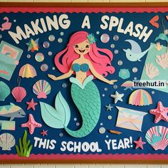 a bulletin board with mermaids and other items on it