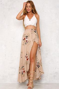 The Ivy Cottage Maxi Skirt is long and flowy, with a gorgeous floral print, a self tie and a half inner lining. Style with an off shoulder crop top and a necklace! Maxi skirt. Half lined. Cold hand wash only. Model is standard XS and is wearing XS. True to size. Slightly stretchy fabric. Cotton/polyester. Flowy Floral Print Maxi Skirt For Festival, Flowy Floral Maxi Skirt For Festival, Floral Print Flowy Maxi Skirt For Festival, Bohemian Flowy Bottoms For Brunch, Bohemian Flowy Maxi Skirt For Brunch, Bohemian Floral Print Maxi Skirt For Day Out, Bohemian Flowy Maxi Skirt For Garden Party, Bohemian Floral Print Skirt For Brunch, Bohemian Flowy Wrap Skirt For Day Out