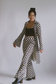 100% Polyester  Models wearing size small and large Checkered Bell Bottom Pants, Luxury Plaid Bottoms For Women, Luxury Casual Plaid Pants, Luxury Houndstooth Formal Bottoms, Luxury Formal Houndstooth Bottoms, Luxury Formal Bottoms With Houndstooth Pattern, Checkered Pants Outfit Men, Chess Outfit, Checkered Pants Outfit