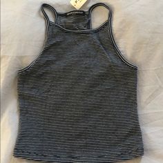 Navy/White Striped Tank Never Been Worn! Striped Racerback Tops For Spring, Fitted Racerback Summer Tops, Striped Fitted Tank Top For Day Out, Fitted Striped Summer Tank Top, Striped Fitted Summer Tank Top, Fitted Striped Tank Top For Summer, Summer Racerback Tops For Day Out, Fitted Racerback Top For Vacation, Brandy Melville Tops