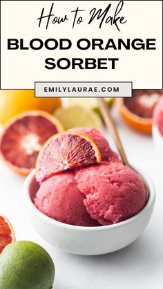 blood orange sorbet in a white bowl surrounded by citrus and limes