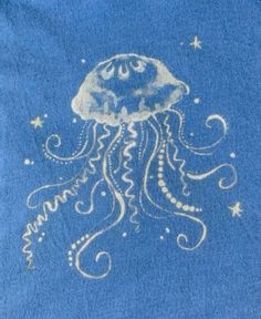 a blue towel with an image of a jellyfish on it