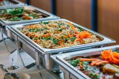 several trays of food are lined up on the buffet table stock photo, picture and royalty