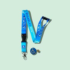 "This blue lanyard is specially designed for those with disabilities and features the message \"Please Be Patient With Me\" along with a blue Pin Badge for easy identification.  Perfect for use during travel or at events, this lanyard is a great way to show support and raise awareness. The lanyard is made of high-quality materials and is suitable for use with a variety of ID cards and badges.  The blue ink colour adds a touch of style to the lanyard while also making it easy to spot.  Order yours today and help spread a message of kindness and inclusivity." Lanyard Badge Design, Handmade Blue Lanyards For Gifts, Adjustable Beaded Blue Lanyards, Blue Lanyard With Key Leash For Personal Use, Lanyard Blue, Adjustable Personalized Pink Lanyard, Be Patient With Me, Blue Pin, Blue Ink