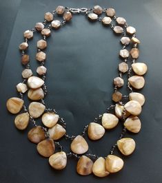 "handmade brown shell,mop, jade stone,glass crystal,gemstone beaded necklace material: brown shell,mop, orange shell,jade stone, glass crystal Size: 18mmx20mm, 12m length: 21\" with 2rows other metal: metal, strong clasp. This item is handwork gemstone necklace, gemstone beaded ❤ If you want other color or length, Please connect me free.this may match earring,bracelet, ❤Please read the store policy before purchase. ❤ Thank you for visiting my shop!" Beaded Brown Shell Necklace As Gift, Brown Beaded Shell Necklace For Gifts, Brown Shell Necklace With Round Beads For Gift, Bohemian Brown Shell Necklace With Round Beads, Beaded Teardrop Brown Necklace, Brown Beaded Teardrop Necklace, Brown Beaded Shell Jewelry, Handmade Brown Shell Necklace, Brown Beaded Shell Necklace