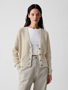 Soft cotton shaker-stitch cardigan.  V-neck.  Easy dropped shoulders.  Long sleeves.  Button front.  Straight silhouette with a relaxed fit.  Hits at the hip.  Models wearing Gap Beige Sweater With Buttons, Thick Cardigan Outfit, Creme Cardigan Outfit, Classic Cardigan Outfit, Chic Beige Button-up Cardigan, Women Cardigan Outfit, Cardigan Hm, Cardigan Outfit Casual, Ralph Lauren Cream Cardigan