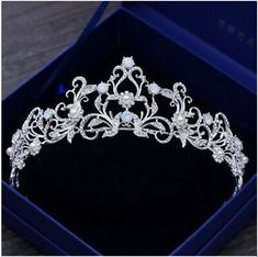 a tiara in a blue box on a table