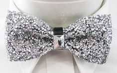 "Beautiful pre-tied and adjustable double tiered banded bow tie Crystal Beaded Will adjust from 13\" through 20\" neck. Bow dimensions 2.5\" x 4.5\". Bow tie Always made by hand and to your special order. Weddings and groups are welcome." Adjustable Ribbon Bow For Party, Fitted Bow Tie With Detachable Bow For Party, Adjustable Decorative Bow Tie For Party, Adjustable Party Bow Tie With Decorative Bow, Adjustable Detachable Bow Tie For Party, Elegant Silver Bow For Party, Elegant Bow Ties For Party, Silver Satin Bow For Party, Silver Satin Party Bow