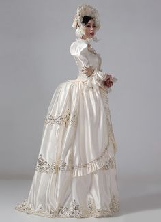 19th Century Champagne Victorian Bustle Dress Gown  Color:Champagne  Material: This dress made of High Quality Satin, soft,smooth and comfortable to wear  Sleeve Length:  Long Sleeve  Dresses Length:Floor Length  Neckline:  Square Collar  Decoration: Ruffles + Lace  Package Includes:  Dress + Hat    The length of skirt about 45 inches (114 cm) long from waist to hem regardless of size. This dress is pictured with a 6-hoop skirt Petticoat underneath to achieve the look. Petticoat are NOT INC Cream Satin Dress For Banquet, Beige Fitted Dress For Costume, Elegant Beige Costume Dress, Floor-length Cream Dress For Debutante Ball, Cream Floor-length Dress For Debutante Ball, White Ball Gown Costume Dress, Elegant White Ball Gown For Costume, White Regency Costume Dress, Regency Style White Victorian Dress For Debutante Ball