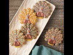 decorated turkey cookies on a white platter