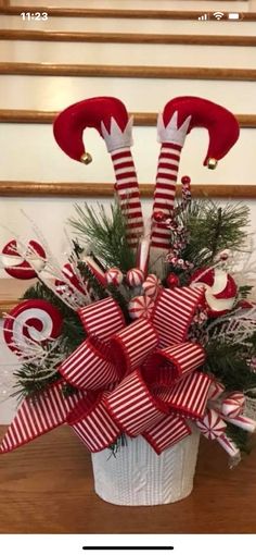 a christmas arrangement with red and white candy canes