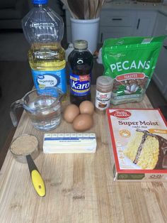 ingredients to make cake sitting on a cutting board