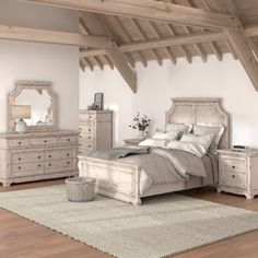 a bed room with a neatly made bed and dressers