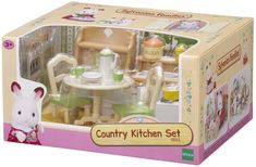 a toy kitchen set in a box with an animal figure on the table and chairs