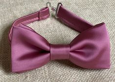 "Choose one of these style : - Bow tie ( adjustable strap) -Bow tie ( clip on- bow tie attaches to the collar) -Regular/Skinny Necktie -Pocket square Solid old Rose bow tie Is a good combination for mix and matching groom, groomsmen and ring bearer. Please Specify Above** BOW TIE- clip-on style/or pre-tied style Baby: newborn- 1Y * Bow Tie: 3in wide Toddle: 2 years- 5 years Bow Tie: 3.5in wide Kids: 6years-12years * Bow Tie: 4in wide Teen/Adult- up to 6.5ft tall * Bow Tie: 5in Style of necktie : Adjustable Pink Bow For Party, Adjustable Satin Bow Tie For Wedding, Pink Satin Bow Tie For Wedding, Adjustable Ribbon Bow Tie For Wedding, Elegant Adjustable Bow Tie For Groom, Classic Adjustable Bow Tie With Ribbon Detail, Classic Adjustable Bow Tie With Ribbon, Classic Adjustable Bow For Groom, Adjustable Satin Bow Tie For Groom