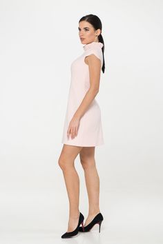 "A pale pink mini dress featuring a frill mock neck, cap sleeves, empire waist, viscose lining, concealed back zipper closure, and a trapeze silhouette. - empire waist - ruffled high neck - short cap sleeves - a line silhouette - concealed back zipper closure - above the knee length (mini) - fully lined Color: pale pink Fiber: 40% viscose, 55% polyester, 5% elastane Lining - 95% viscose, 5 % elastane. For size S: length- 34,5\" (88 cm) Our model wears size S (US 6) and is 171cm/5'6\" tall. You m Feminine A-line Mini Dress, Feminine Solid Mini Dress, Chic Cap Sleeve Mini Dress For Spring, Elegant Cap Sleeve Mini Dress For Summer, Feminine Fitted Cap Sleeve Dress, Solid Color Stretch Mini Dress With High Neck, Feminine A-line Mini Dress With Stretch, Feminine Cap Sleeve Dresses For Spring, Summer Stretch Mini Dress With Cap Sleeves