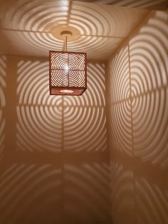 the light is shining on the wall in the room that has circles drawn on it