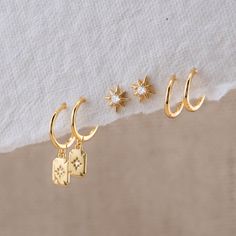 Shine Bright with our Celestial Earrings Gift Set! This handpicked collection features star studs, huggie earrings with charm, and small, simple huggies perfect for second piercings or cartilage accents. Whether you choose a set of two or three, our matching-gift-sets ensure a celestial sparkle that's as unique as you are! - Material: Hypoallergenic, Solid 925 sterling silver and 14 K gold filled finish  - Dimension:  21.5 mm x 5 mm / Huggie inner diameter: 9 mm - Turnaround time: Same day or Ne Double Earring Stack, Cool Earrings Aesthetic, Cute Simple Earrings, Hoop Stack, Simple Silver Earrings, Jury Duty, Double Earrings, Earring Sets, Tiny Earrings