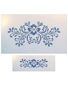 two blue stencils on a white background, one with an ornate design in the middle