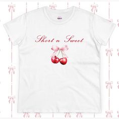 A women's tee inspired by Sabrina Carpenter's album, Short n Sweet, featuring cherries and a bow design. This tee exudes a fun and playful vibe, perfect for fans of Sabrina Carpenter or those who appreciate whimsical designs. Ideal for casual wear or as a statement piece for concerts, music festivals, or everyday outings. Product features - 100% cotton composition for comfort - Double needle sleeve and bottom hems for durability - Side seams for shape retention - Neck and shoulder tape for stabi Sabrina Carpenter Album, Fruit Graphic, Sweet Top, Bow Women, Sweet Cherries, Fashion Top, Bow Design, Graphic Shirt, Sabrina Carpenter