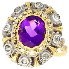 A stunning antique 5.92 carat amethyst and 0.32 carat diamond, 18 karat yellow gold and silver set dress ring; part of our diverse antique jewelry and estate jewelry collections. This stunning, fine and impressive antique amethyst ring has been crafted in 18k yellow gold with a silver setting. The pierced decorated, ornamented scrolling setting is ornamented with a central bezel set 5.92Ct oval mixed cut amethyst. The amethyst is surrounded by a total of eight individually silver bezel set Dutch Antique Amethyst Ring, Unconventional Engagement Rings, Amethyst And Diamond Ring, Amethyst Gem, Amethyst Jewelry, Dress Rings, Antique Jewellery, Amethyst Ring, Antique Rings