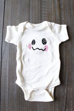 Mimikyu Face Pokemon Baby Bodysuit White Onesie With Character Print For Playtime, Cute White Onesie With Cartoon Print, Cute White Onesie With Character Print, Cute White Cartoon Print Onesie, Cute Cotton Bodysuit With Character Print, Playful Cotton Bodysuit With Character Print, White Bodysuit With Cartoon Print For Playtime, Playful Unisex Onesie With Cartoon Print, Playful White Short Sleeve Onesie