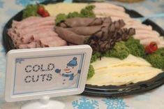 an assortment of cold cuts on a plate