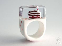 a ring with a slice of cake in it