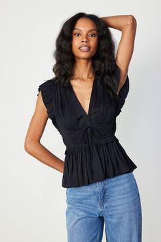 Add depth and dimension to your outfits with this plunging V-neck top. Accented by fluttery cap sleeves, the micropleated bodice features tie detailing and a comfortable cinched waist before flaring out to a ruffled peplum. •V-neckline •Pleated cap sleeves •Tie detail at front •Elasticized waist •Ruffled peplum Item number 2430072 50%RECYCLE POLY 50%POLY Gentle Cycle Cold Deep Winter Clothes, Closet Fabric, Blue Floral Sundress, Peplum Shirt, Peplum Shirts, Deep Winter, Floral Sundress, Peplum Blouse, Fashion Line