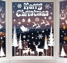 the window is decorated with christmas decorations and santa claus's sleighs