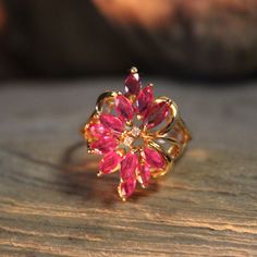 Stunning 1990s Vintage 14k Solid Gold Pink Topaz & Diamond Ring 3.3 Grams Size 7.5 Solid 10K Gold Diamond Pink Topaz Rings Vintage Diamond Topaz Ring Beautiful pink topaz and diamond ring in solid 14k yellow gold 1980's There are 12 x 1/8tcw pink topazes that surround the diamonds There are two 1/16tcw diamonds in the center of the ring Weight 3.3 grams Stamped 14k (solid yellow gold) Makers marks  Beautiful solid 14k gold cocktail ring Please view all the photo's as they are part of the descrip Gold Ruby Crystal Ring With Prong Setting, Diamond Topaz Ring, Topaz Rings, Topas Ring, Topaz Diamond Ring, Pink Topaz Ring, Cute Engagement Rings, Diy Canvas Wall Art, Rings Vintage