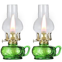 two green glass lamps sitting next to each other