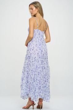 A gorgeous ditsy floral pattern flows throughout this whimsical asymmetric tiered maxi dress. Embroidery detail and unique seaming give a luxe, feminine feel to this warm-weather style. Pair with slide sandals or block heels to elevate the look. Product Details Material: 100% Polyester. Fit: True to size. Body length: 52" from shoulder to hem (size Small). Fabric: Lightweight chiffon.Features: Adjustable spaghetti straps, asymmetric tiers, raised hemlines, embroidered white flowers, fully lined. Lavender Floral Print Maxi Dress, Lavender Sleeveless Floral Print Maxi Dress, Purple Floor-length Dress With Floral Embroidery, Summer Floral Embroidered A-line Maxi Dress, Lavender Floral Print V-neck Maxi Dress, Ditsy Floral Pattern, Dress Embroidery, Summer Handbags, Lilac Dress