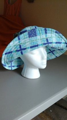 Classic Northwest style rain hat, light weight and warm for the rainy season or for any season anywhere.  4 layer construction, cotton heavy duty fabric on the outside, felt inner layer, plastic layer laminated to the interior cotton lining to keep the rain out.  Wide brim keeps the rain off your face and neck. Beautiful bright seasonal blues perfect to cheer up your rainy season wardrobe, especially if the season lingers month after month. Lined Brimmed Hat, One Size Fits Most, Outdoor Wide Brim Cloche Hat, Reversible Wide Brim Sun Hat One Size Fits Most, Reversible Wide Brim Sun Hat One Size, Reversible Wide Brim Sun Hat, Playful Wide Brim Bucket Hat With Upf 50+, Fun Wide Brim Bucket Hat With Upf 50+, Colorful Brimmed Bucket Hat With Upf 50+, Playful Bucket Hat With Upf 50+ And Curved Brim