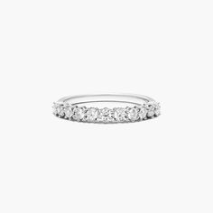 a white gold wedding band with five diamonds